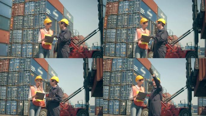 两名集装箱码头员工在航运港口五颜六色的货物集装箱堆前工作和交谈