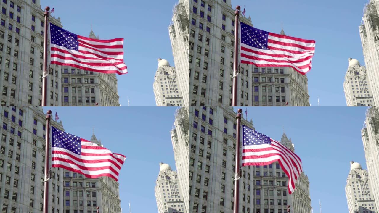 慢镜头高清:美国国旗与蓝天和芝加哥城镇的背景