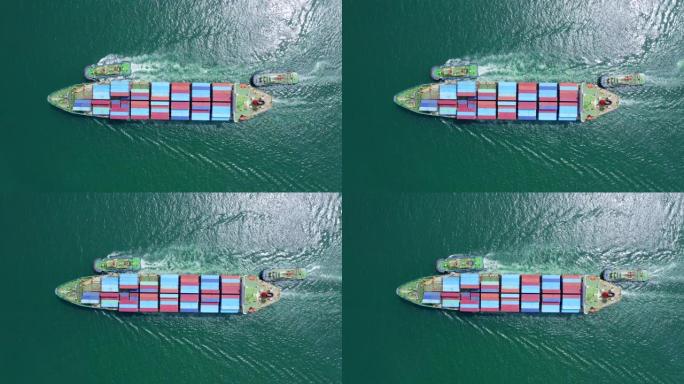 货船运载集装箱驶向港口。它是进出口经济的重要组成部分