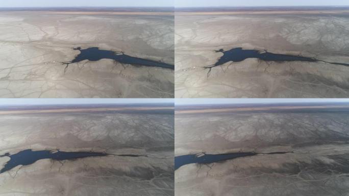 高空平移视图显示了由于干旱和气候变化而造成的破坏程度，博茨瓦纳奥卡万戈三角洲恩加米湖这些通常丰富的水