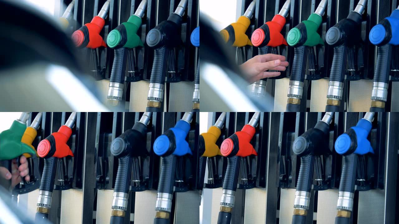 加油站有一个燃料喷嘴从气泵中取出。汽油燃料，加油站概念。