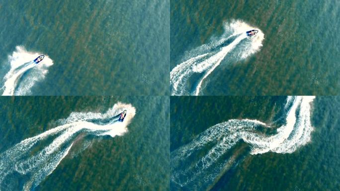 俯视图waverunner骑手穿越大海。