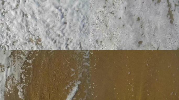 在棕色的沙子上画了题字爱，被波浪、日落、海洋背景冲走。