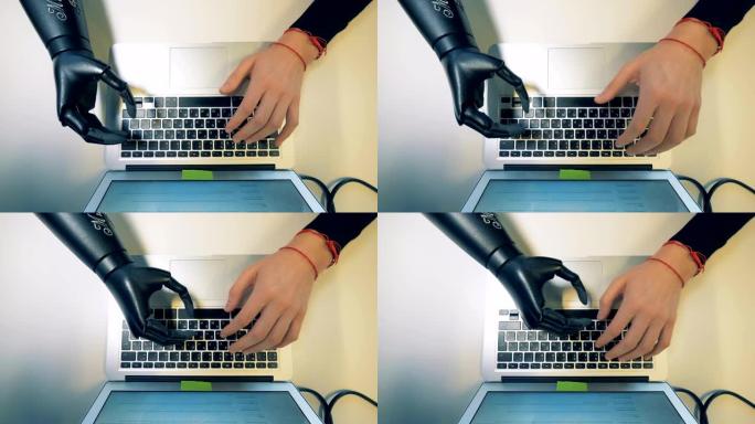 机器人机器人手臂键入笔记本电脑键盘。