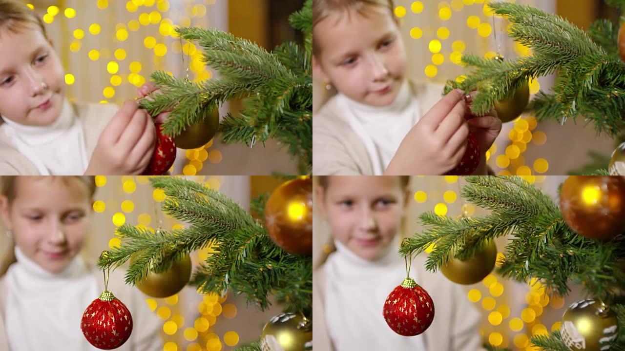 小女孩在圣诞树上挂着闪亮的小玩意