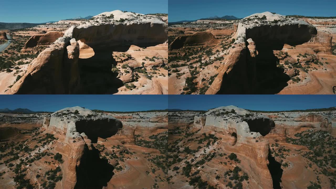 令人难以置信的岩石拱门的惊人航拍，游客探索令人惊叹的美国国家公园山脉景观