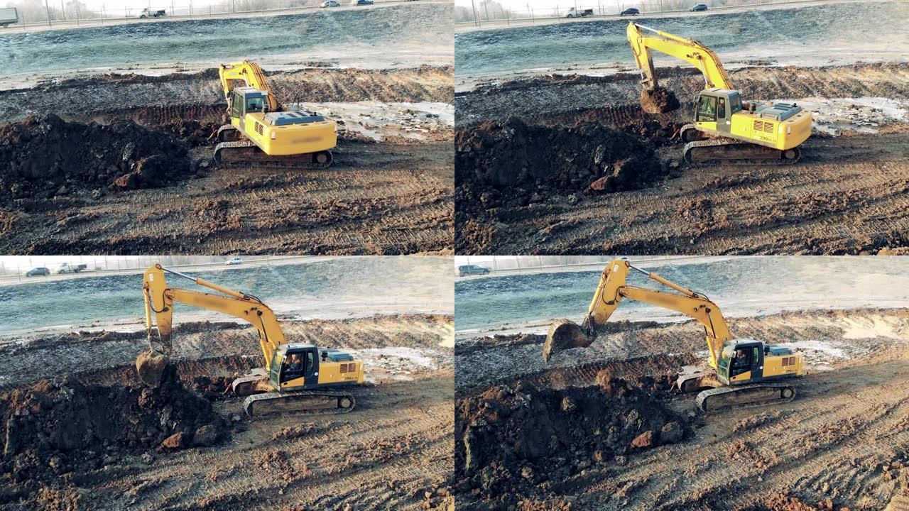 挖掘机在高速公路旁挖地