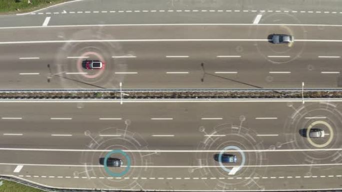 汽车经过前往城市的高速公路的鸟瞰图。