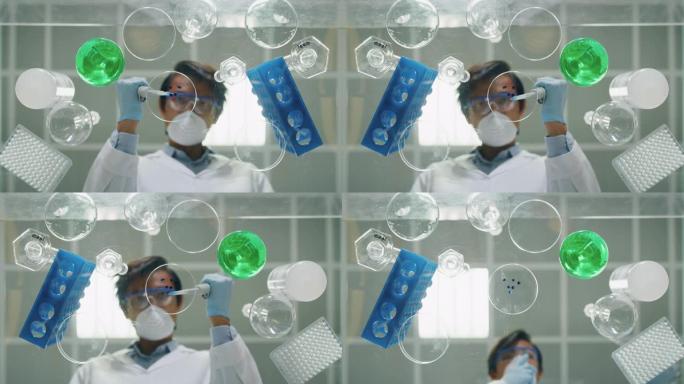 中国男性科学家的另一种镜头正在用移液管分析液体，以提取实验室试管中的DNA和分子