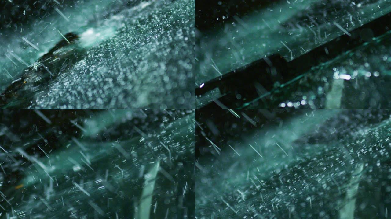 超级慢动作，在下雨的时候关闭一个玻璃，雨刷正在把水从它上面取下来。