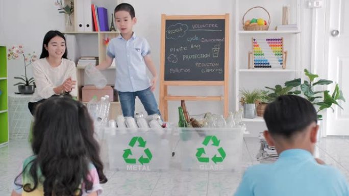 亚洲教师妇女带孩子教学生如何回收生活垃圾慈善，人与生态，回收与生态生活方式-生态教育与意识，日常生活