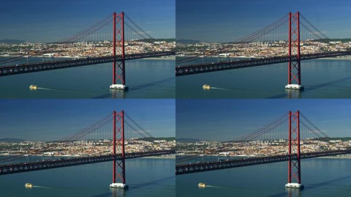 葡萄牙里斯本。在晴朗的晴天，横跨塔霍河的 '25 de Abril' 大桥上的汽车交通。4K