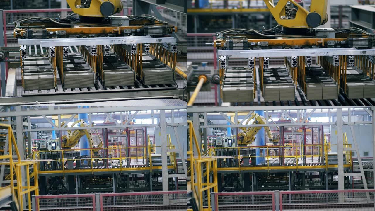 工厂工业机器用砖块工作，移动它们。