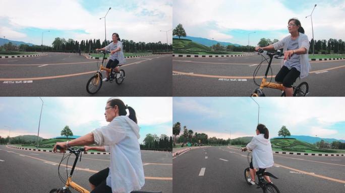 资深亚裔女子在公园骑脚踏车