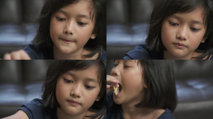 亚洲年轻女孩喜欢在家吃饼干