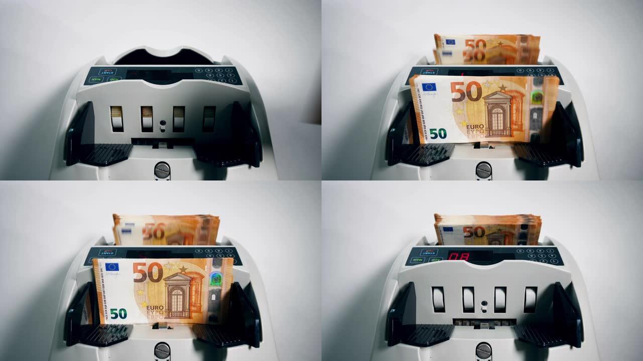 一个人将一捆欧元钞票放入计数机。