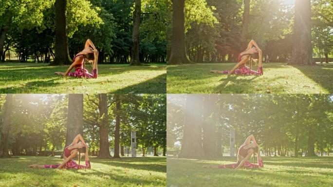 女士灵活的年轻女子在阳光明媚的公园练习瑜伽