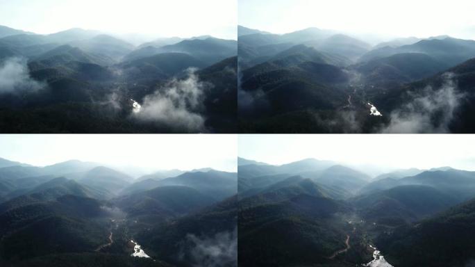 空中拍摄云层和森林山上