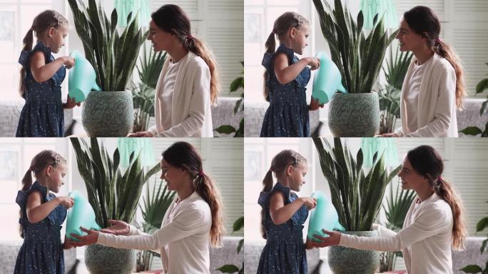 儿童女孩拿着喷壶水房子植物帮助妈妈