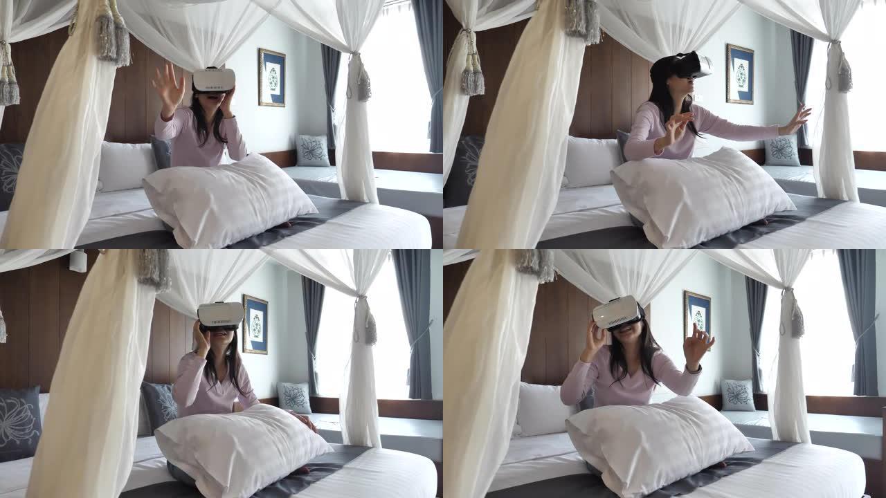 在卧室里使用VR眼镜的亚洲女性