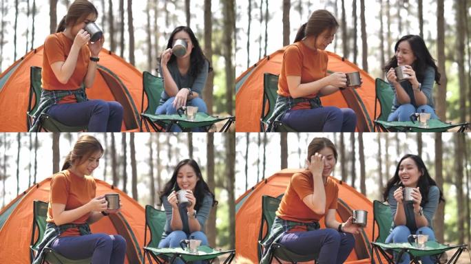 两个亚洲女性朋友在露营度假中一起碰杯