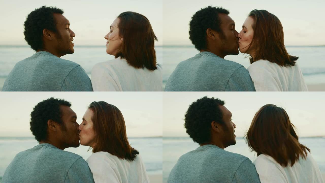 可爱的情侣在海边亲吻