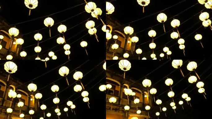 特写: 传统手工灯笼照亮了越南的旧市场。