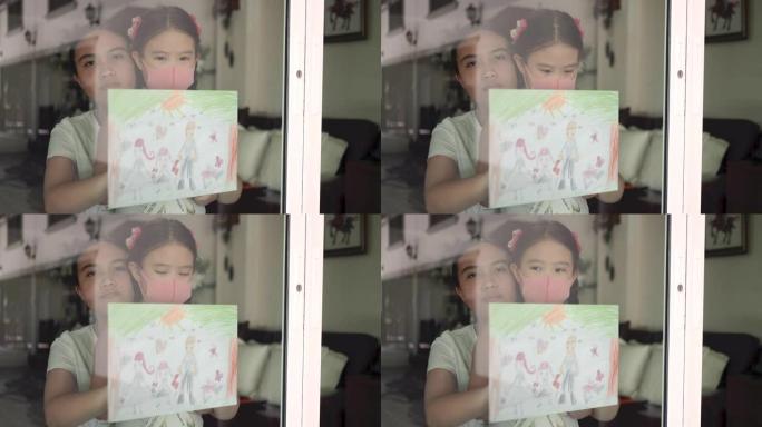 在检疫新型冠状病毒肺炎或冠状病毒大流行期间，哭泣的女孩和她的妹妹抱着她的画穿过玻璃门
