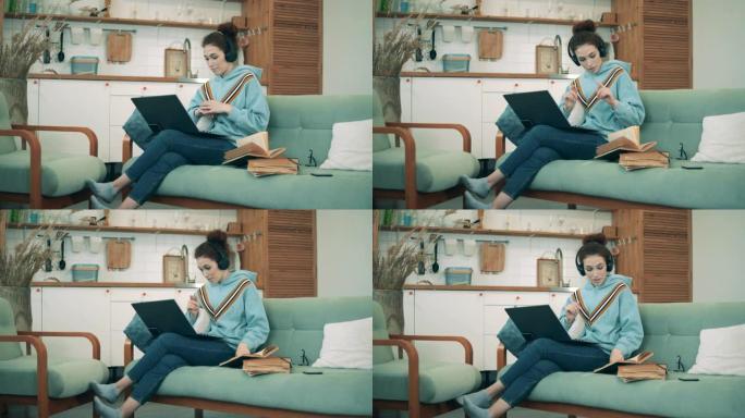 年轻女子在新型冠状病毒肺炎大流行期间在家工作的视频中引用书籍。