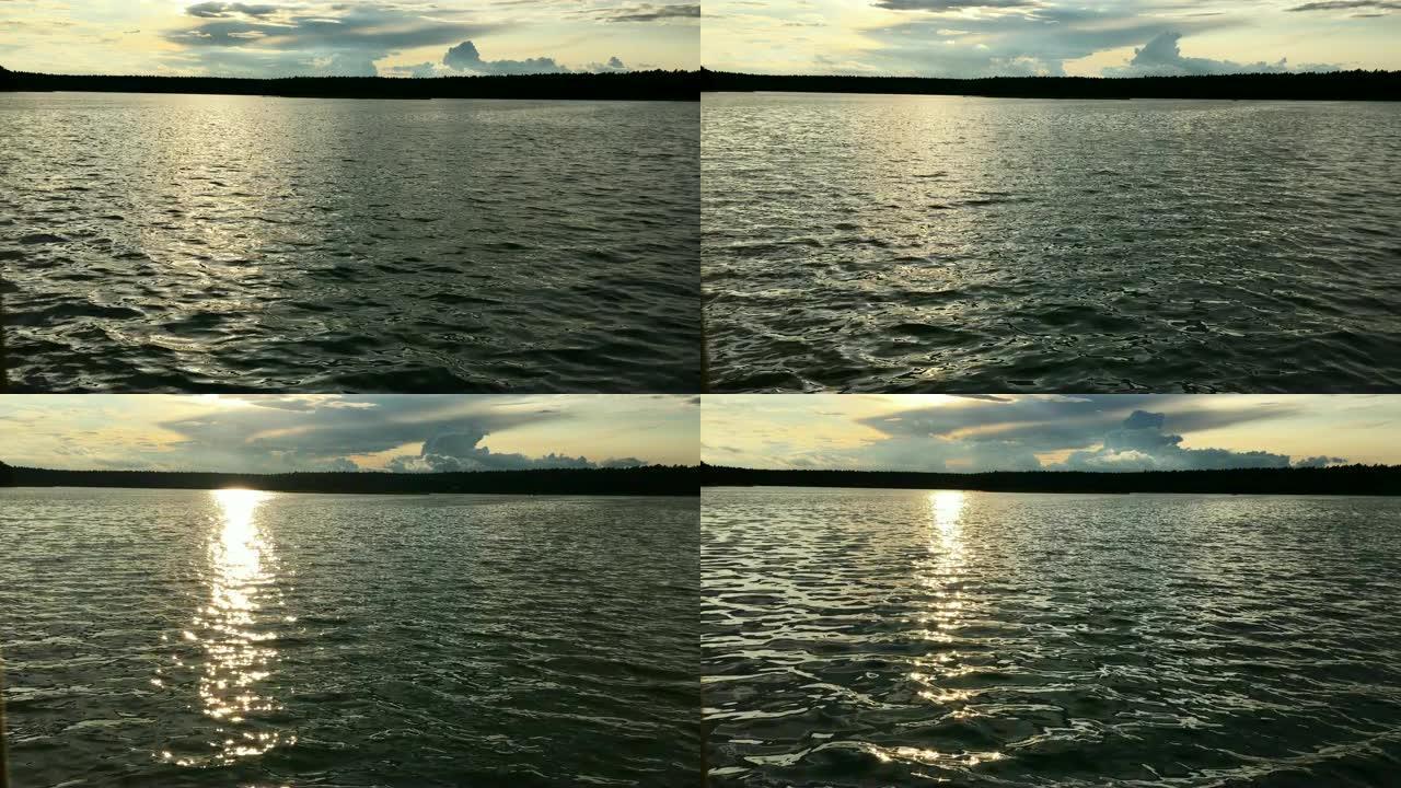 超现实的日落湖。夕阳西下的鲜艳色彩