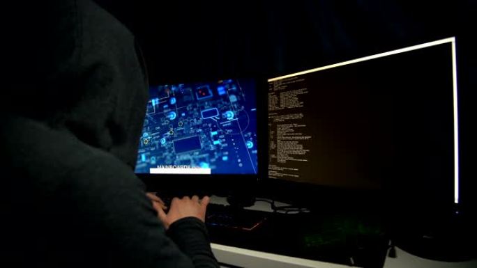 在计算机上工作的男性黑客