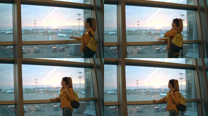 可爱的女士正在观察机场的景色