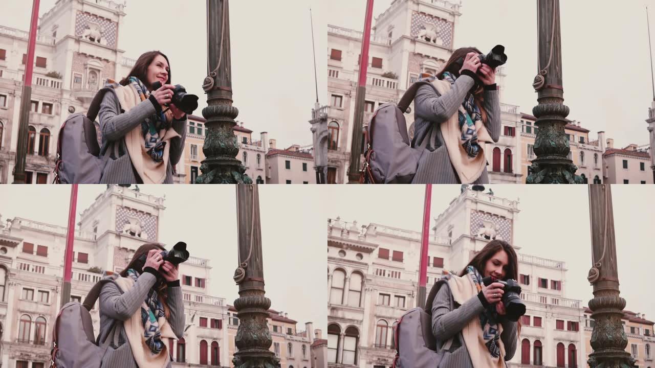 美丽的女职业记者用相机拍摄意大利威尼斯老城区的照片，微笑慢动作。