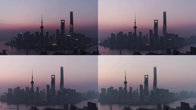 黎明时分上海天际线的T/L泛无人机视图，从夜晚到白天/中国上海