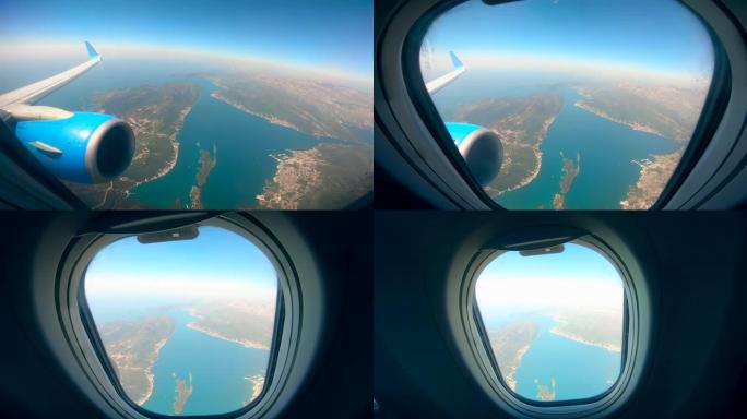 从大海和陆地上的飞机机舱观看