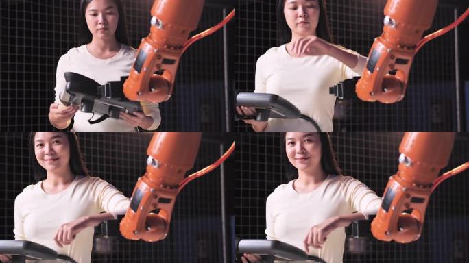 一个未来主义的假肢机器人手臂由一名亚洲少女sminging开发工程师在深夜工作的研究实验室。手臂移动