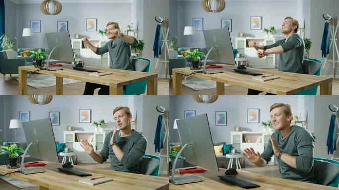 这位英俊的年轻人坐在电脑前跳舞的肖像。年轻人在家玩得开心。