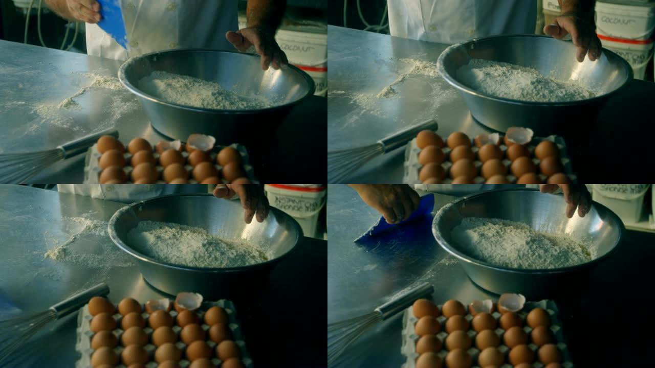 男厨师在4k厨房里搅拌鸡蛋和面粉