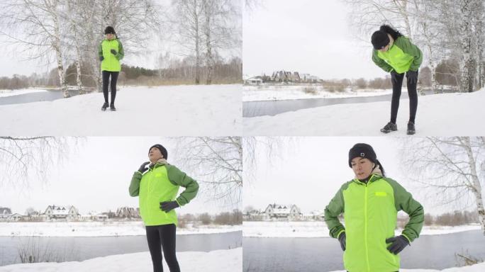 在雪地里跑步后休息的女性慢跑者
