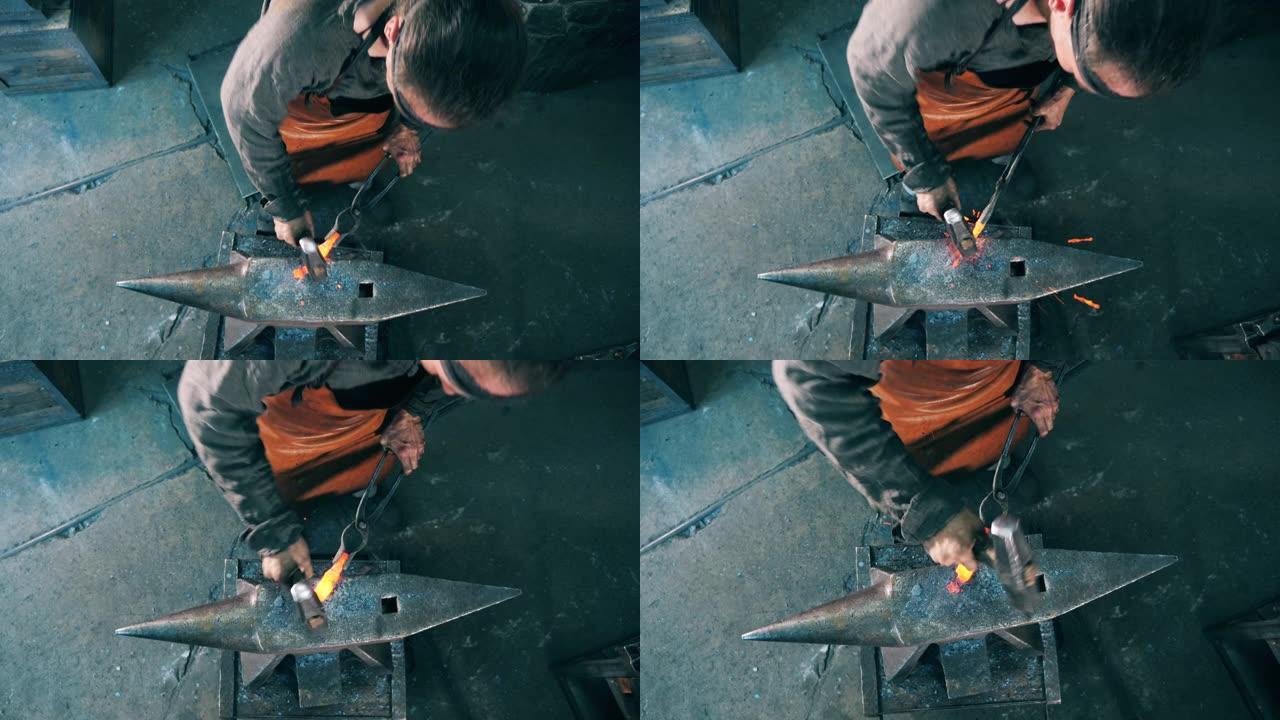 铁匠在铁砧上塑造一把刀，用锤子击打它。