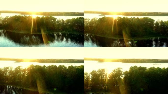 日落时被草地包围的湖的景色