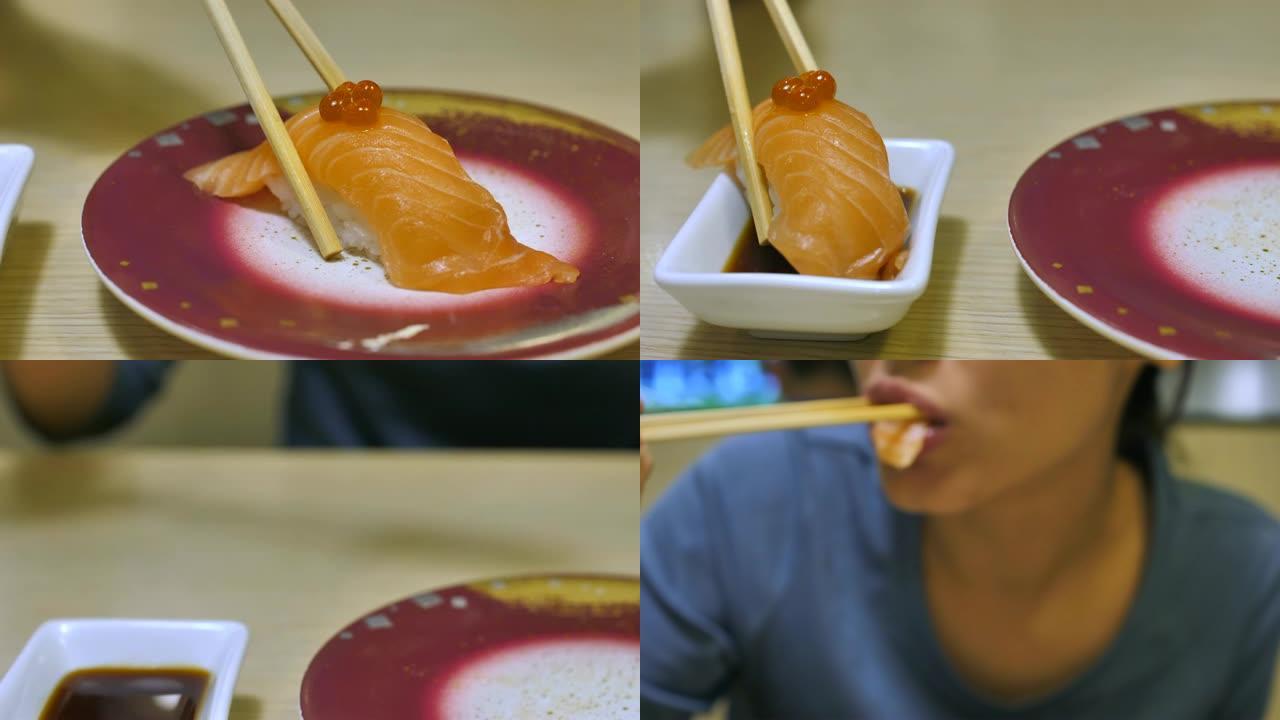 吃寿司的女人鱼片蘸料