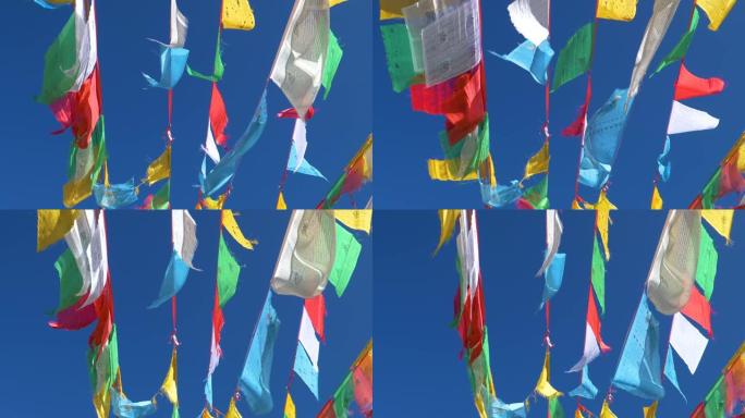 自下而上: 在吹过西藏的风中悬挂在绳索上的祈祷旗