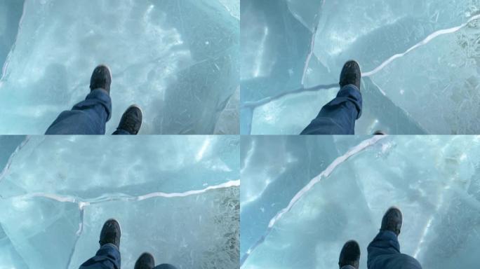 POV: 穿着运动鞋的男人沿着美丽的绿松石冰冻的湖面缓慢行走