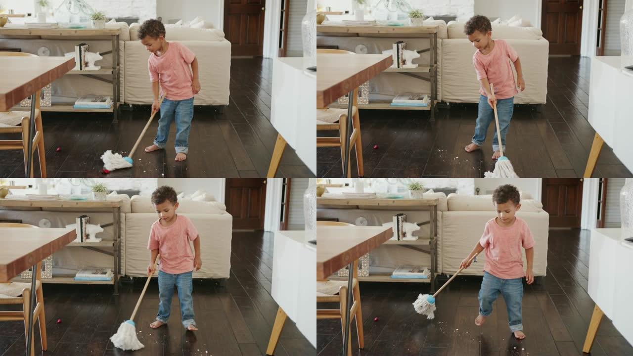 三岁的黑人男孩用拖把清洁餐厅地板，全长