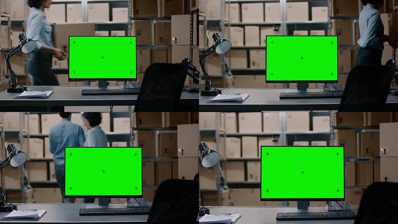 在带有绿色模拟屏幕显示的仓库计算机中，站在桌面上。在背景成排的货架上，装满了准备好发货的纸板箱和包裹