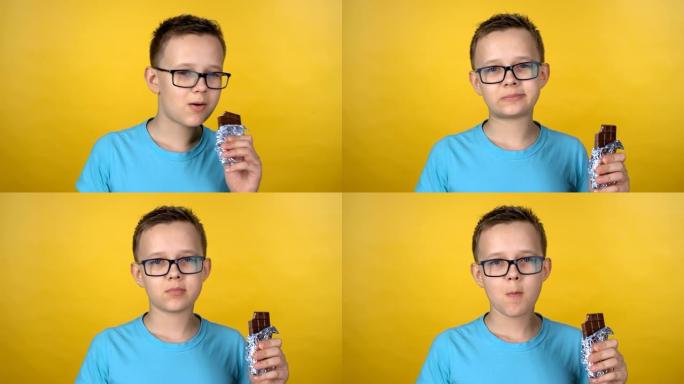 戴眼镜的男孩吃巧克力
