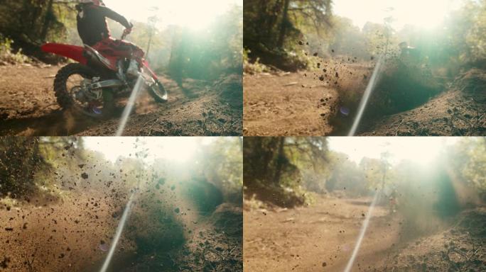 MS超级慢动作越野摩托车骑手在阳光明媚的路线上超速行驶，踢起泥土