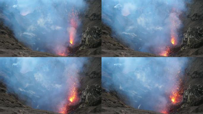 特写: 太平洋上的活火山喷出了发光的橙色熔岩。