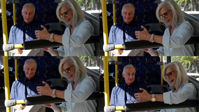 在4k公交车上旅行时用手机自拍的高级女性